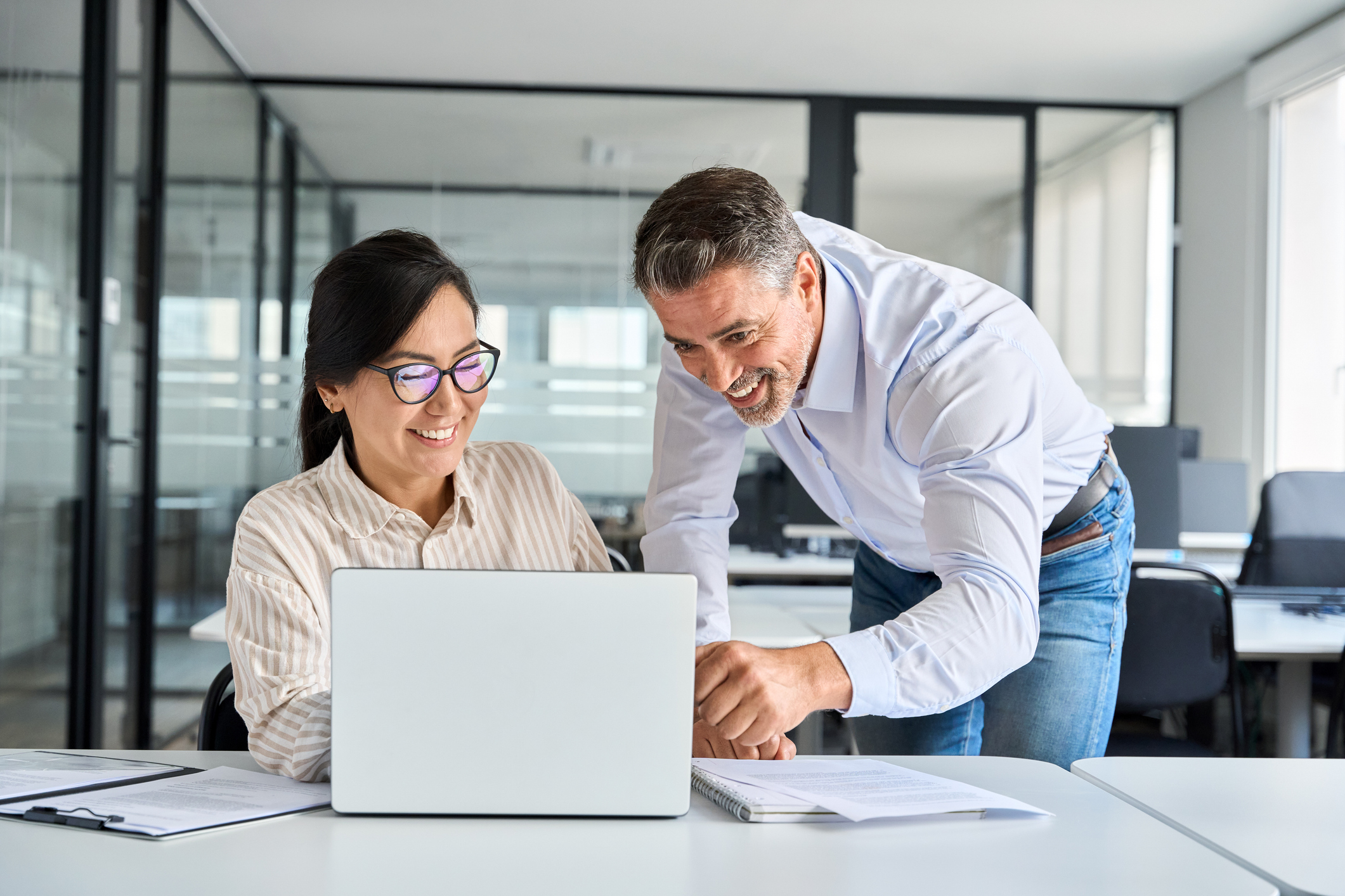 employees working on laptop in office