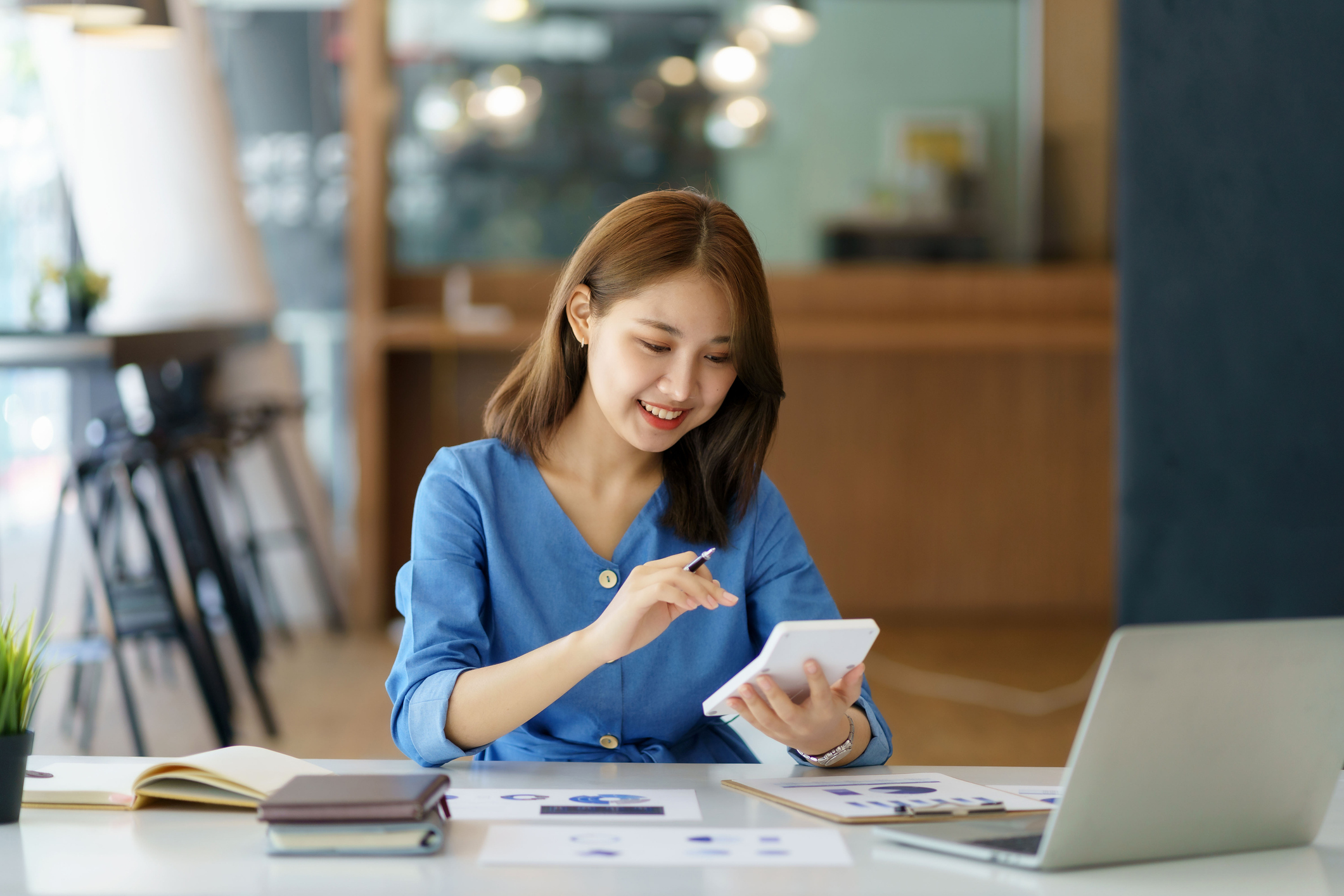 business woman using calculator