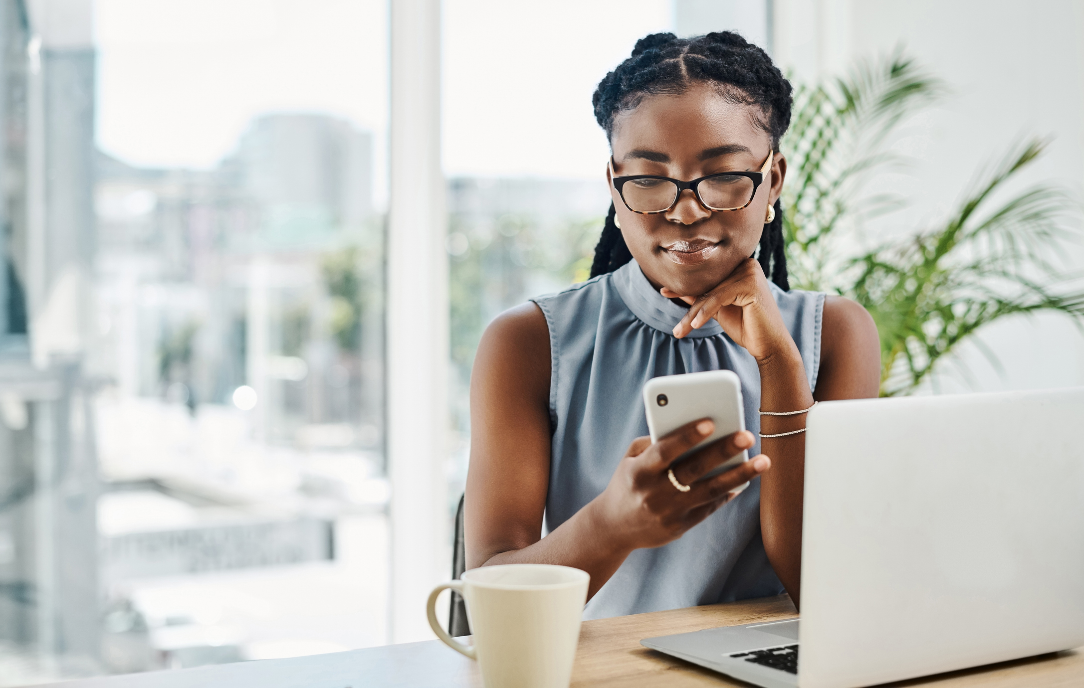 woman looking at cell phone